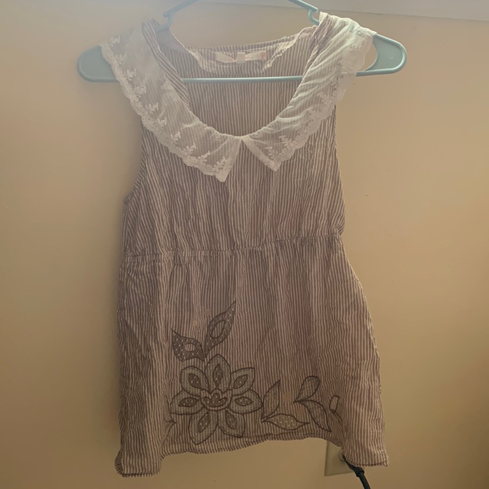 Striped tank top with lace trim around neckline